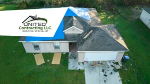 Aerial view of a damaged roof that has been covered with tarpaulins or temporary patches, showing a temporary fix to protect the interior of the building from inclement weather until a permanent repair can be made.